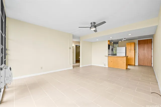 a view of a livingroom with a kitchen