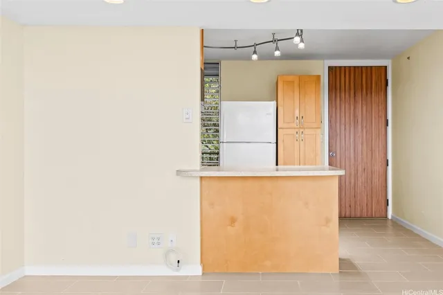 a bathroom with a window and a shower
