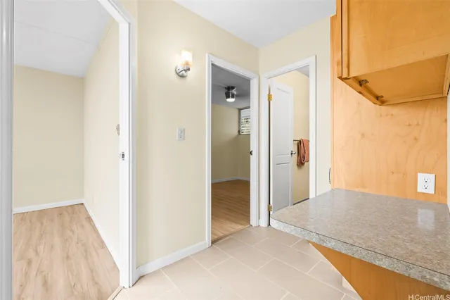 a view of hallway with wooden floor