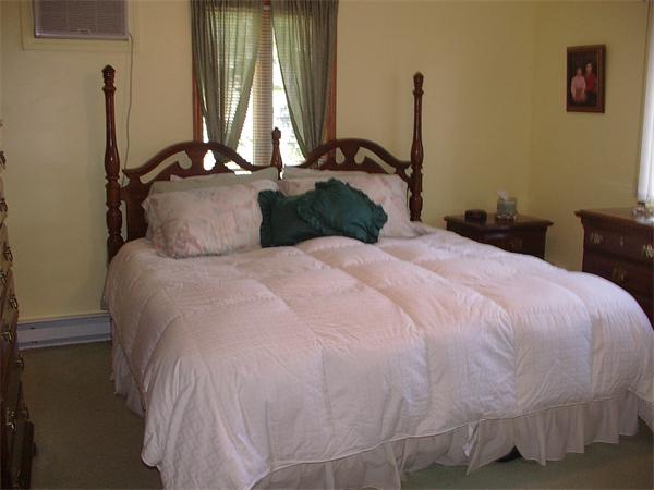 26 Harjean Road Billerica, MA 01821 - Photo 15 of 25 a bedroom with a bed and window