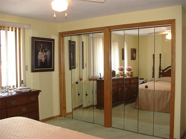 26 Harjean Road Billerica, MA 01821 - Photo 16 of 25 a bedroom with a balcony a bed and a mirror