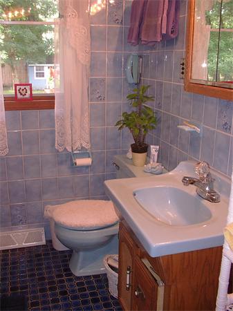 26 Harjean Road Billerica, MA 01821 - Photo 23 of 25 a bathroom with a sink and a toilet