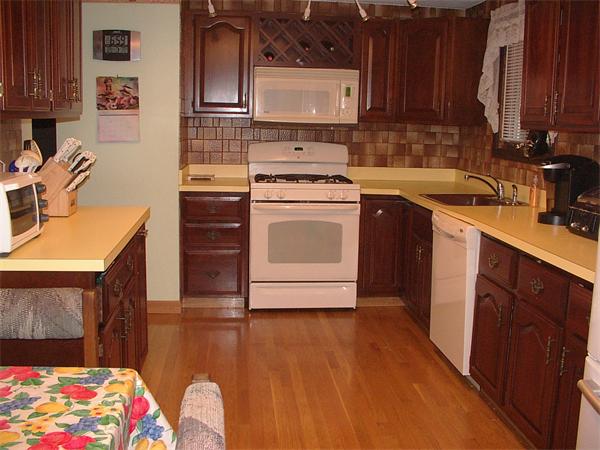 26 Harjean Road Billerica, MA 01821 - Photo 7 of 25 a kitchen with a sink a stove and cabinets