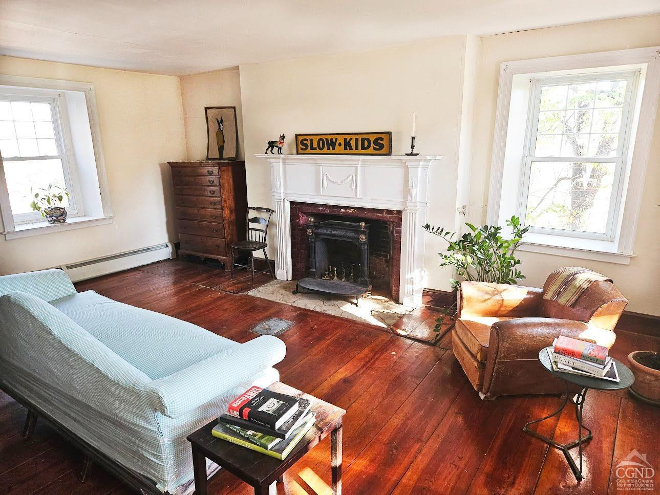 274 Fingar Road Hudson, NY 12534 - Photo 20 of 87 a living room with furniture and a fireplace