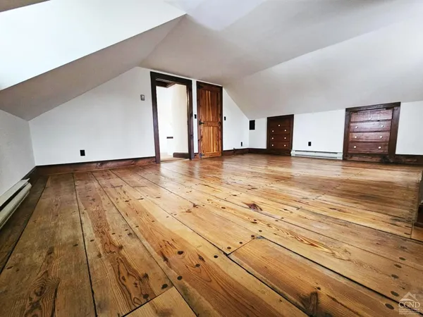 a balcony with wooden floor and fence