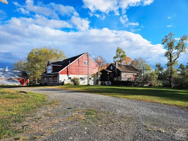 a view of an empty room and a window