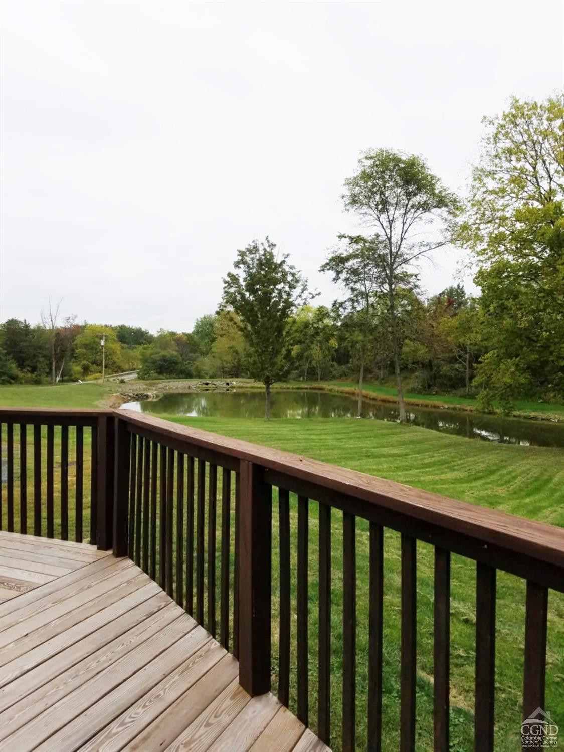 274 Fingar Road Hudson, NY 12534 - Photo 36 of 87 a balcony with wooden floor and fence