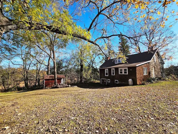 a view of outdoor space with garden and trees