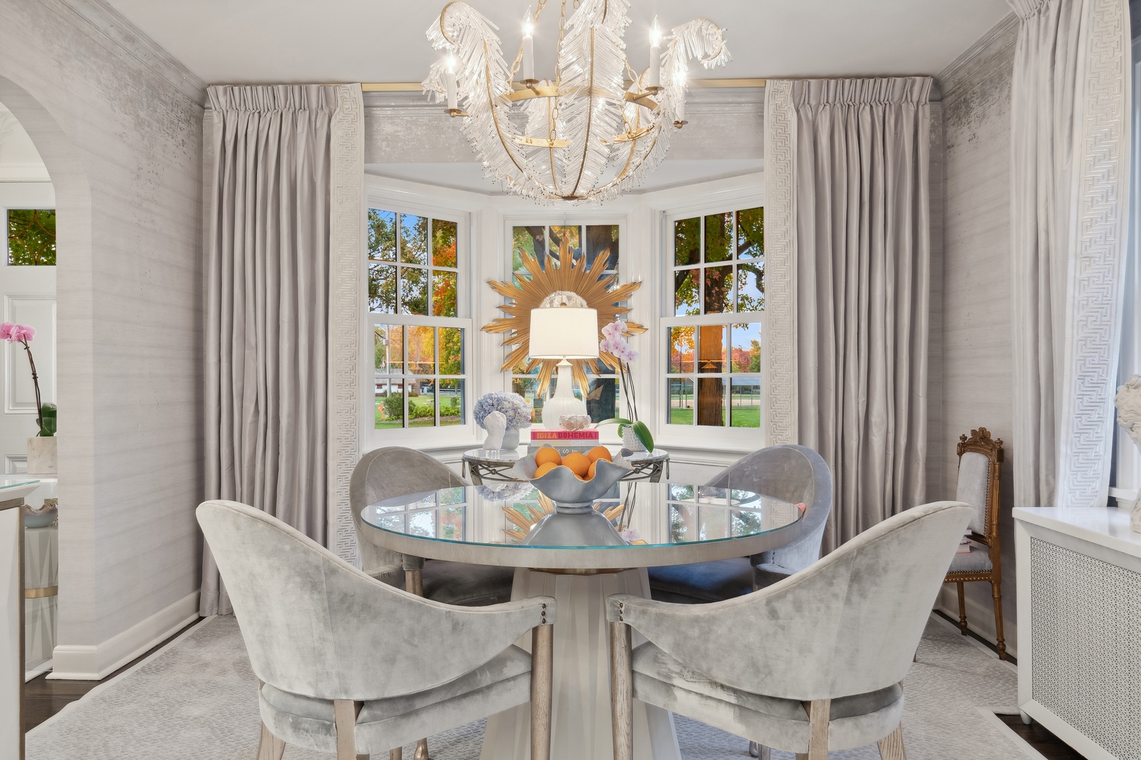 85 Sunset Place Lake Forest, IL 60045 - Photo 12 of 64 a view of a dining room with furniture a chandelier and large window