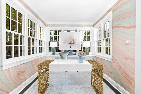 a spacious bedroom with a bed and a window