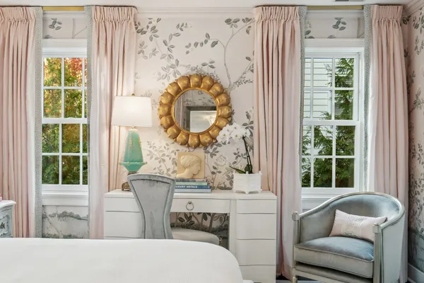 a spacious bedroom with a bed and a window