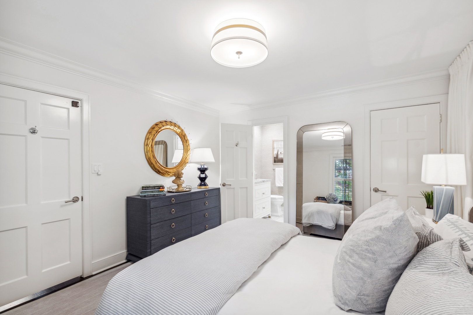 85 Sunset Place Lake Forest, IL 60045 - Photo 39 of 64 a bedroom with a bed and a chandelier