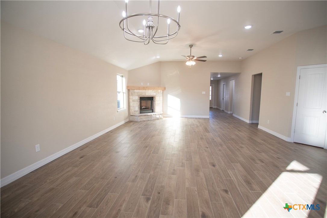 3213 Digby Drive Belton, TX 76513 - Photo 2 of 18 wooden floor in an empty room with a window