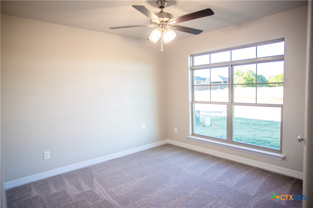 3213 Digby Drive Belton, TX 76513 - Photo 9 of 18 an empty room with a window and a fan