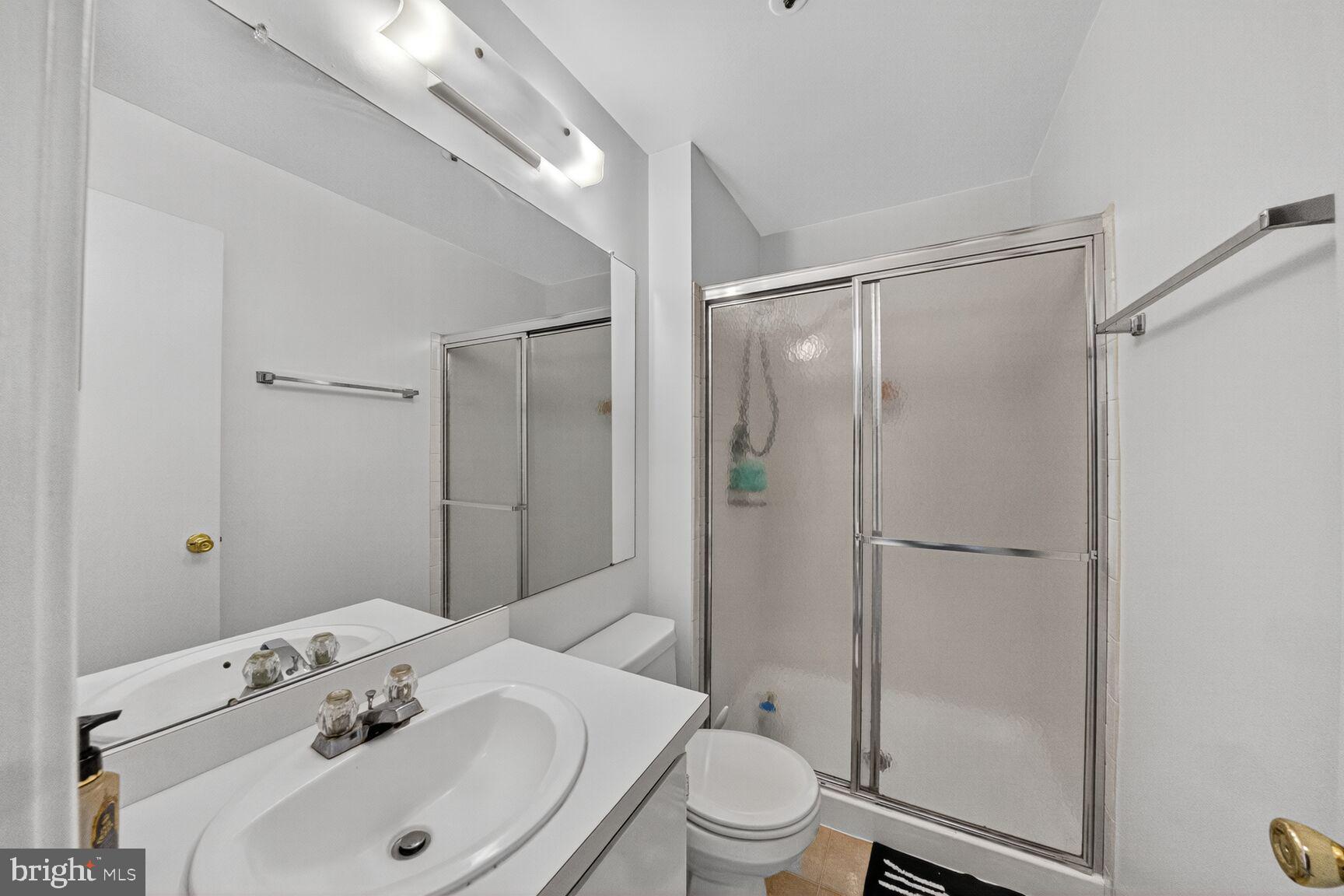 14901 McKisson Court, Unit 7CC Silver Spring, MD 20906 - Photo 14 of 34 a bathroom with a sink toilet and shower