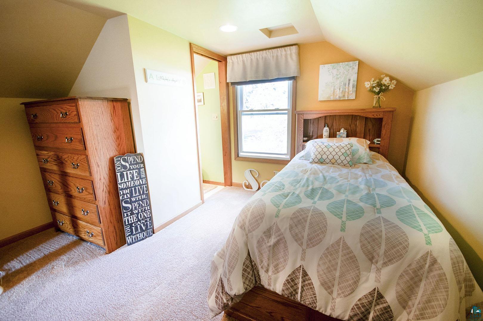 4726 Hermantown Road Hermantown, MN 55811 - Photo 23 of 40 Carpeted bedroom featuring vaulted ceiling