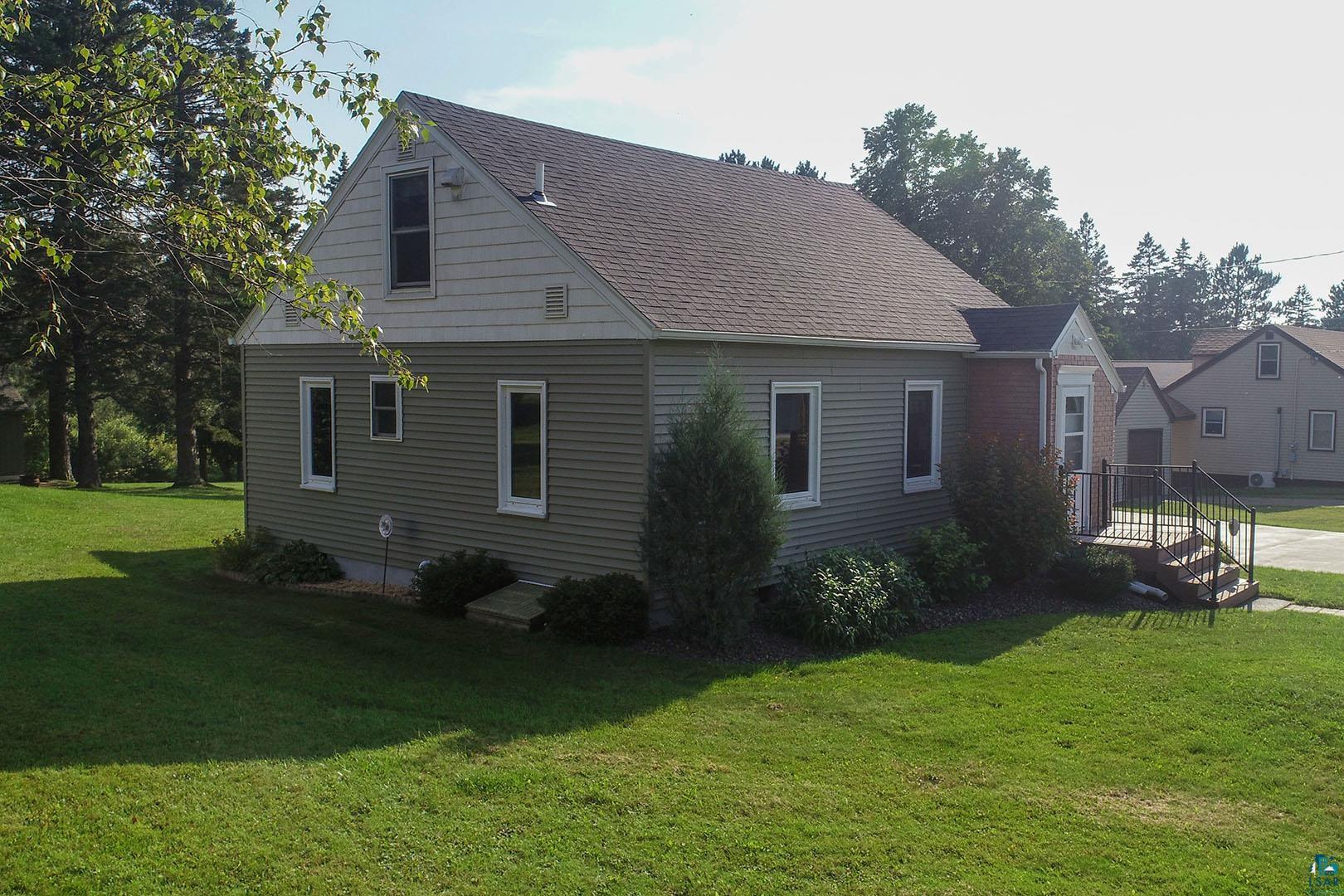 4726 Hermantown Road Hermantown, MN 55811 - Photo 3 of 40 View of side of home featuring a lawn