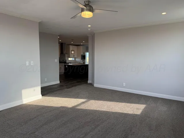 a bathroom with a granite countertop shower sink and mirror