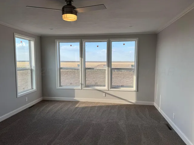 a kitchen with stainless steel appliances kitchen island granite countertop a stove a sink and a microwave