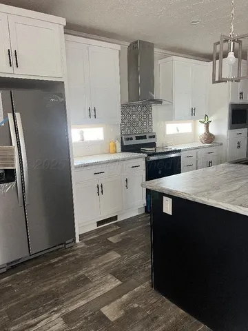 a view of an empty room with closet