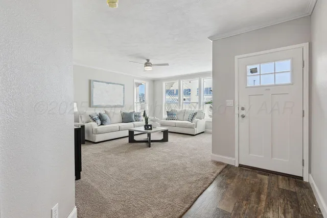a kitchen with counter top space and wooden floor