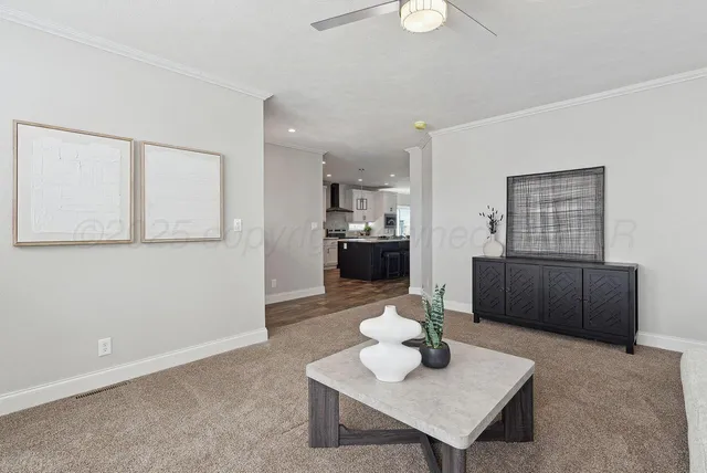 a large kitchen with stainless steel appliances a stove a sink dishwasher and a stove with wooden floor