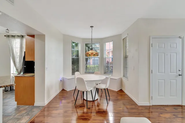 a kitchen with granite countertop a stove top oven microwave and cabinets
