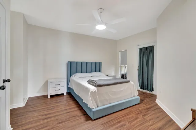 a bedroom with a bed and a table