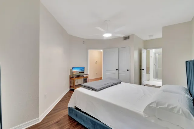 a bathroom with a shower a toilet and a shower