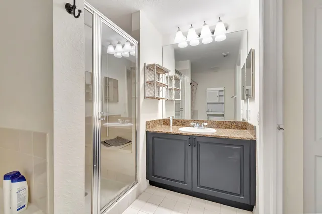 a view of a livingroom with wooden floor and a fireplace