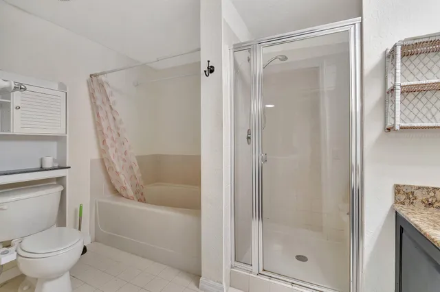 a view of storage and utility room with washer and dryer