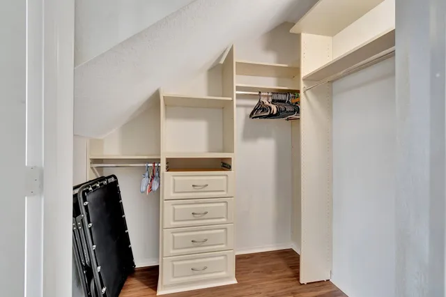 a view of a house with a yard and plants