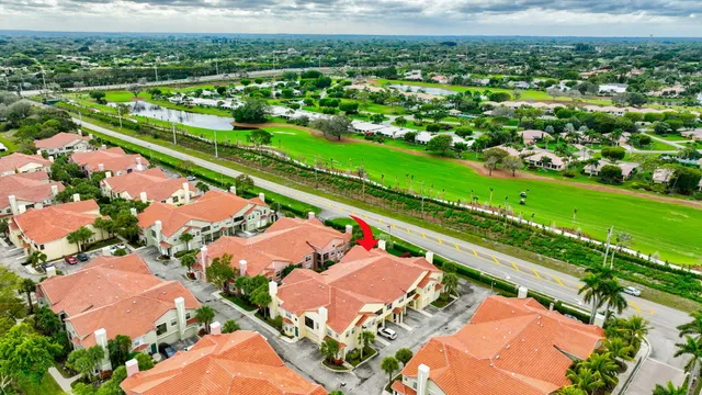 a backyard of a house with green plants and trees