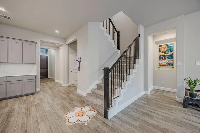 a view of entryway with wooden floor