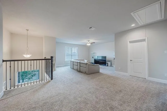 a room with furniture and a rug