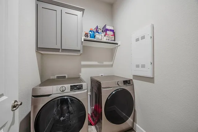 a view of washer and dryer in a utility room