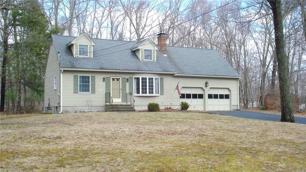 74 Bushnell Hollow Road Sprague, CT 06330 - Photo 1 of 1 a front view of a house with a yard