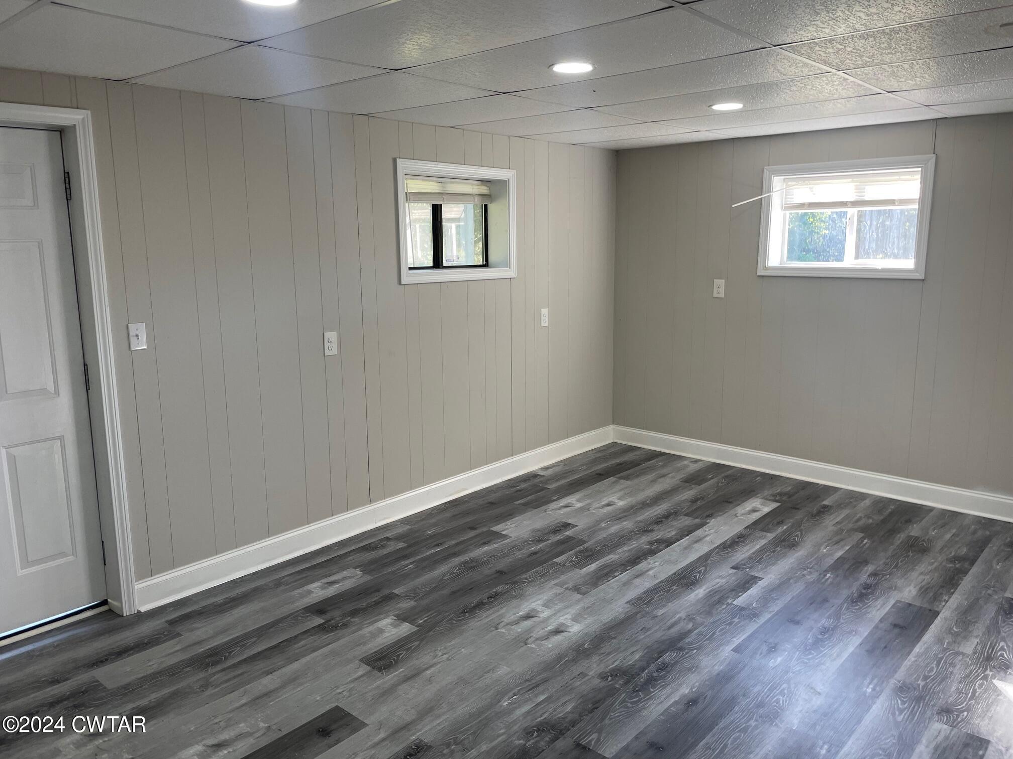 113 Ebenezer Road Mercer, TN 38392 - Photo 16 of 36 an empty room with wooden floor and windows