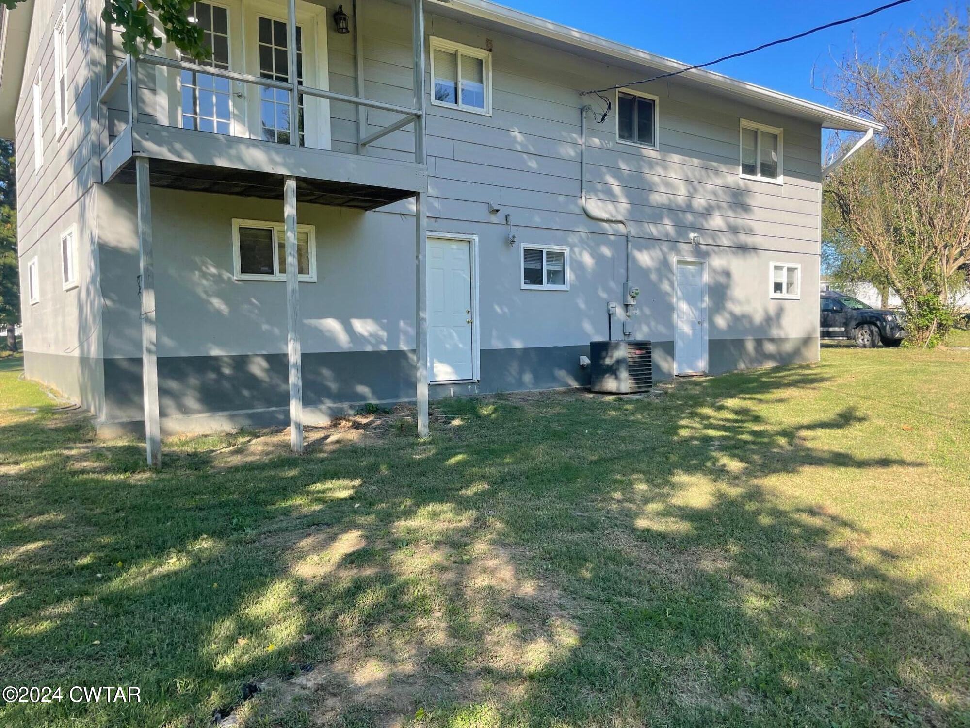 113 Ebenezer Road Mercer, TN 38392 - Photo 20 of 36 a backyard of a house with table and chairs