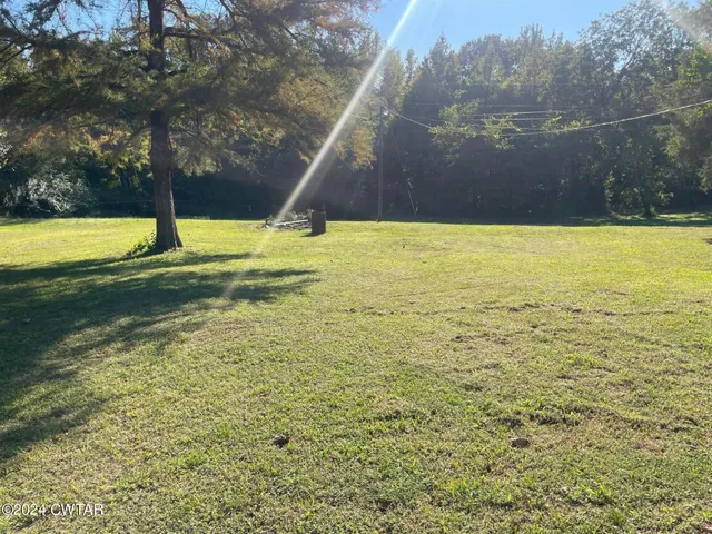 a view of a swimming pool with an outdoor space and seating area