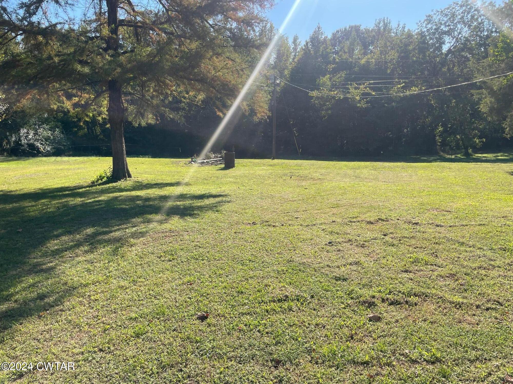 113 Ebenezer Road Mercer, TN 38392 - Photo 21 of 36 a view of a swimming pool with an outdoor space and seating area