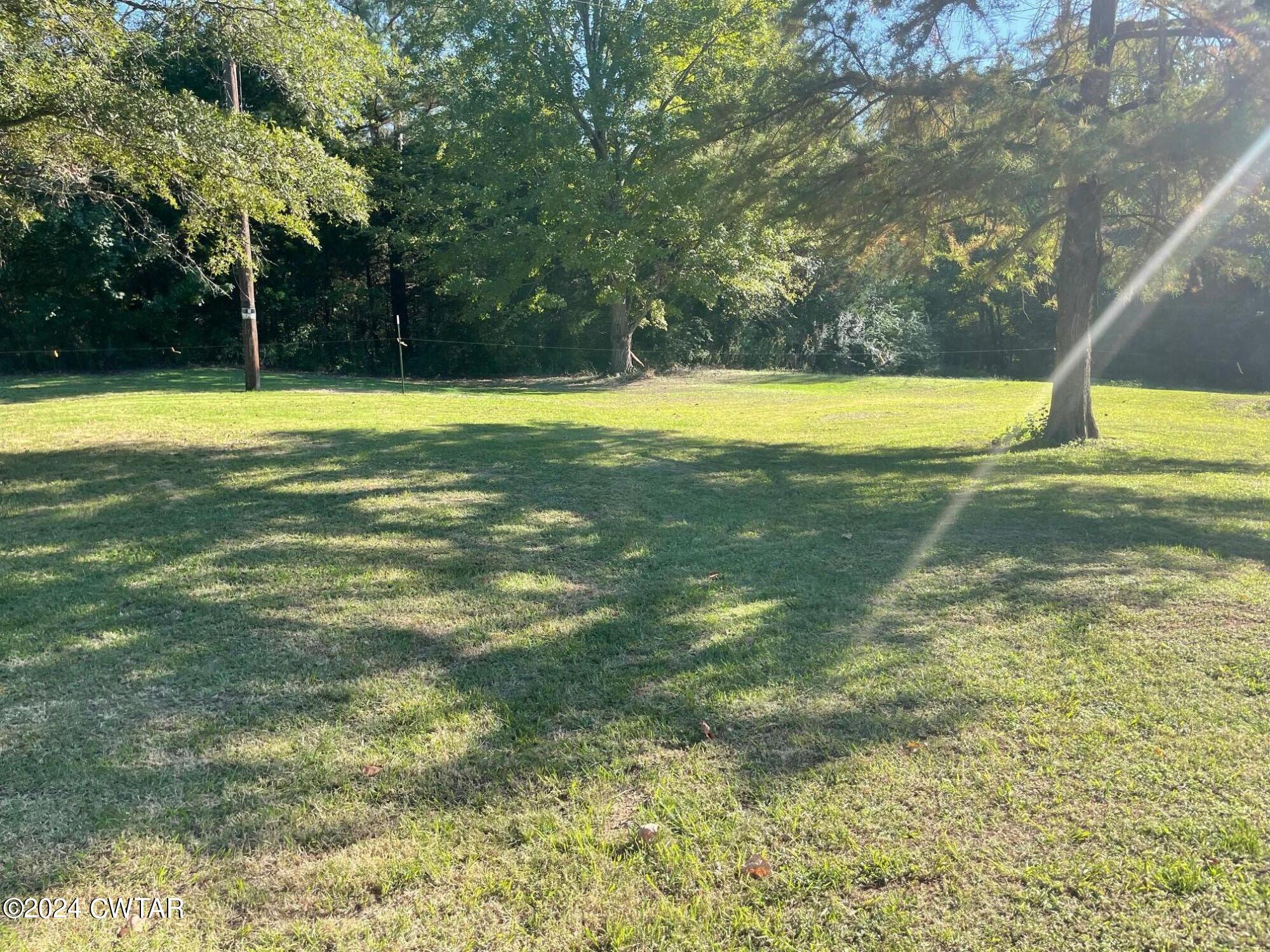 113 Ebenezer Road Mercer, TN 38392 - Photo 22 of 36 a view of a swimming pool with an outdoor space and seating area