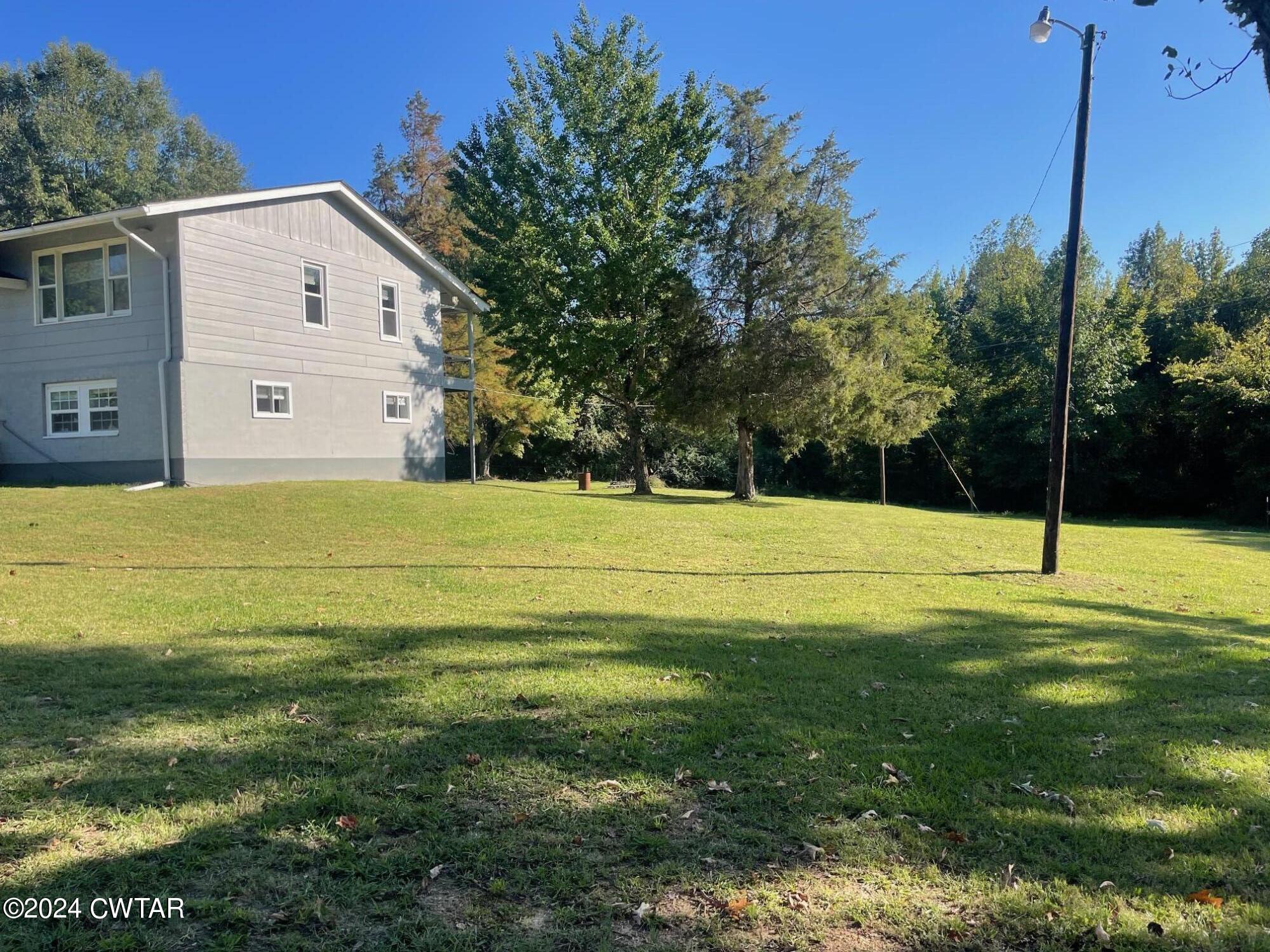 113 Ebenezer Road Mercer, TN 38392 - Photo 23 of 36 a view of a house with a yard
