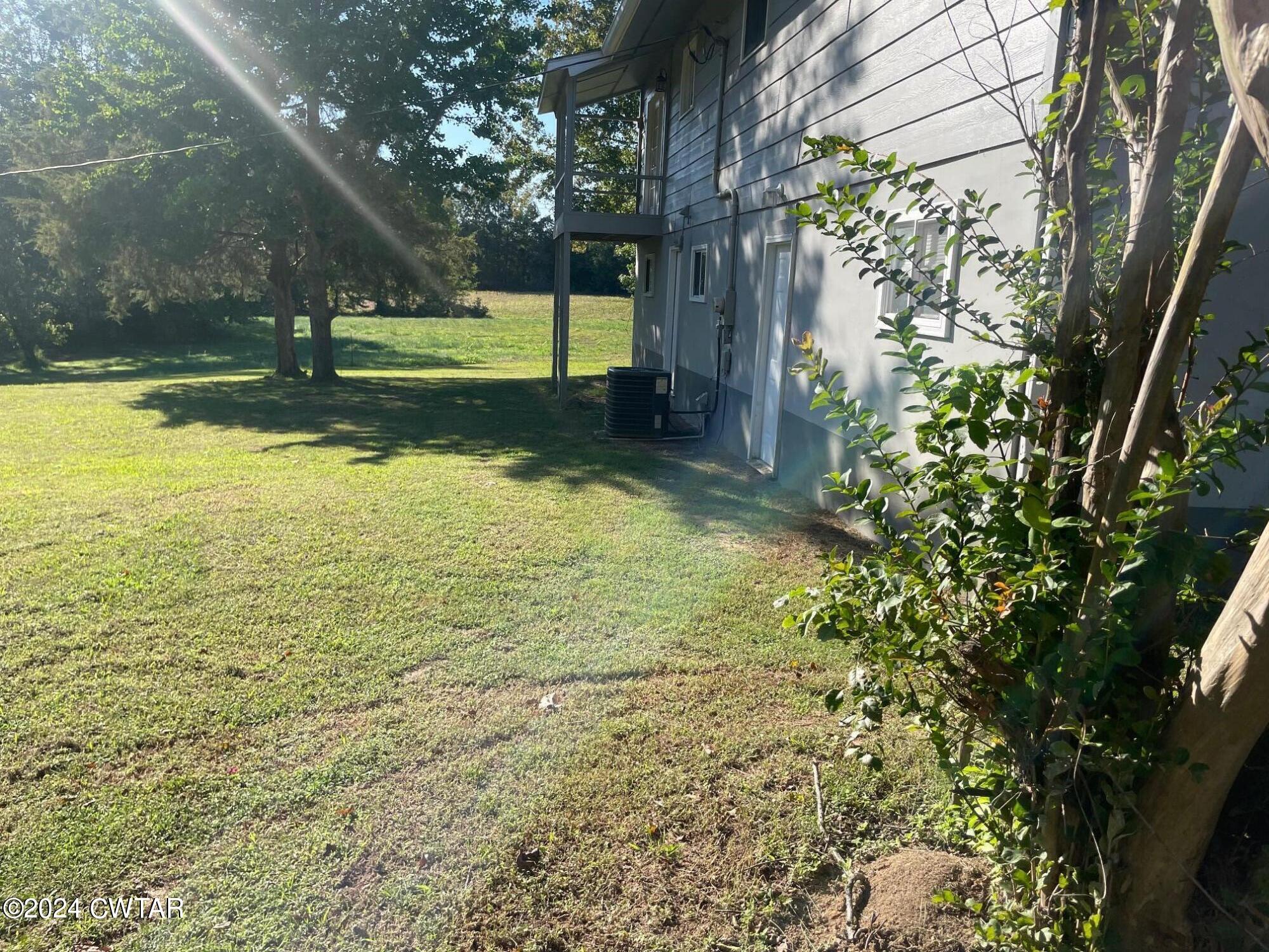 113 Ebenezer Road Mercer, TN 38392 - Photo 24 of 36 a view of yard with swimming pool and outdoor seating
