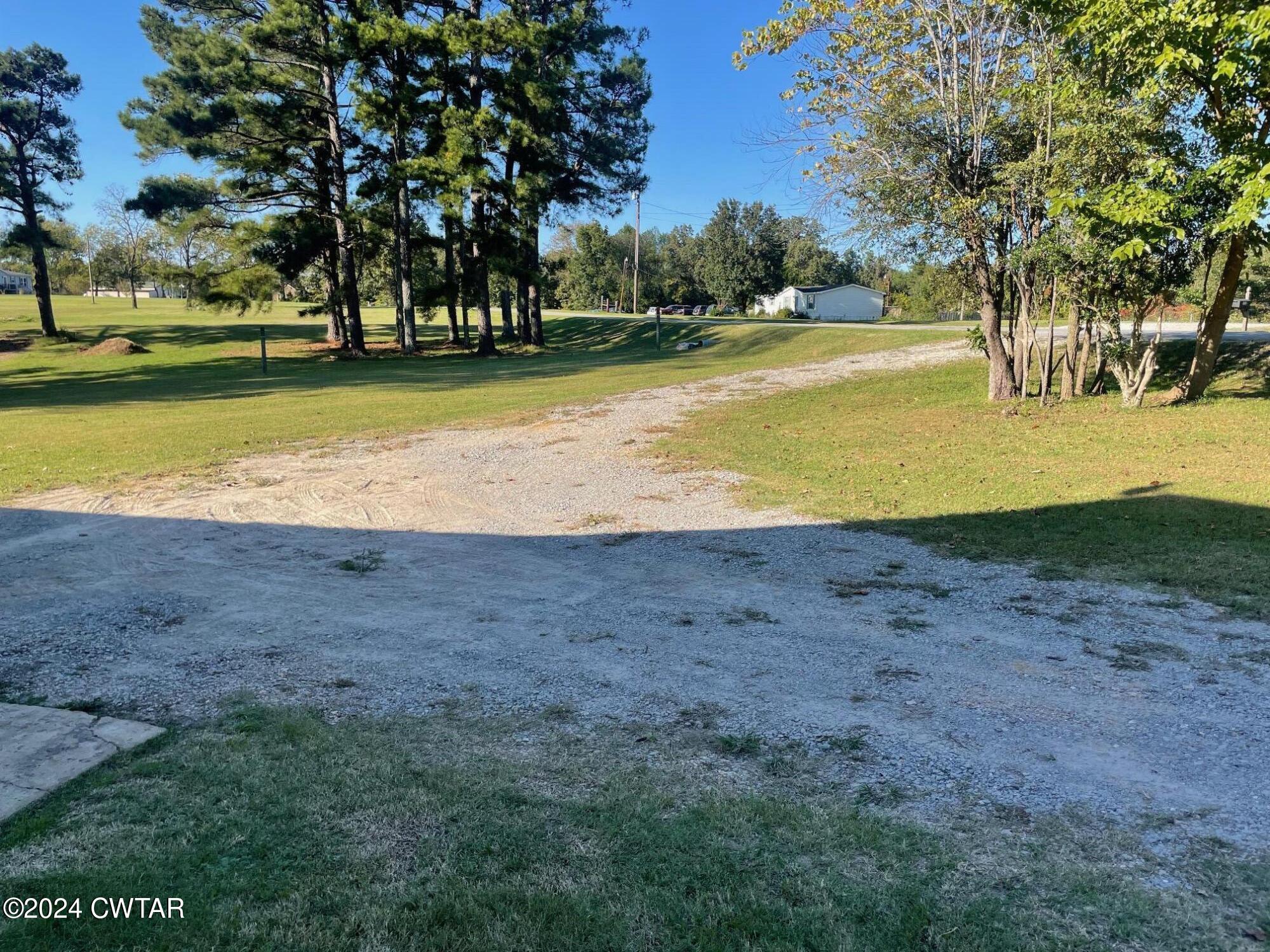 113 Ebenezer Road Mercer, TN 38392 - Photo 25 of 36 a view of a swimming pool with an outdoor space and seating area