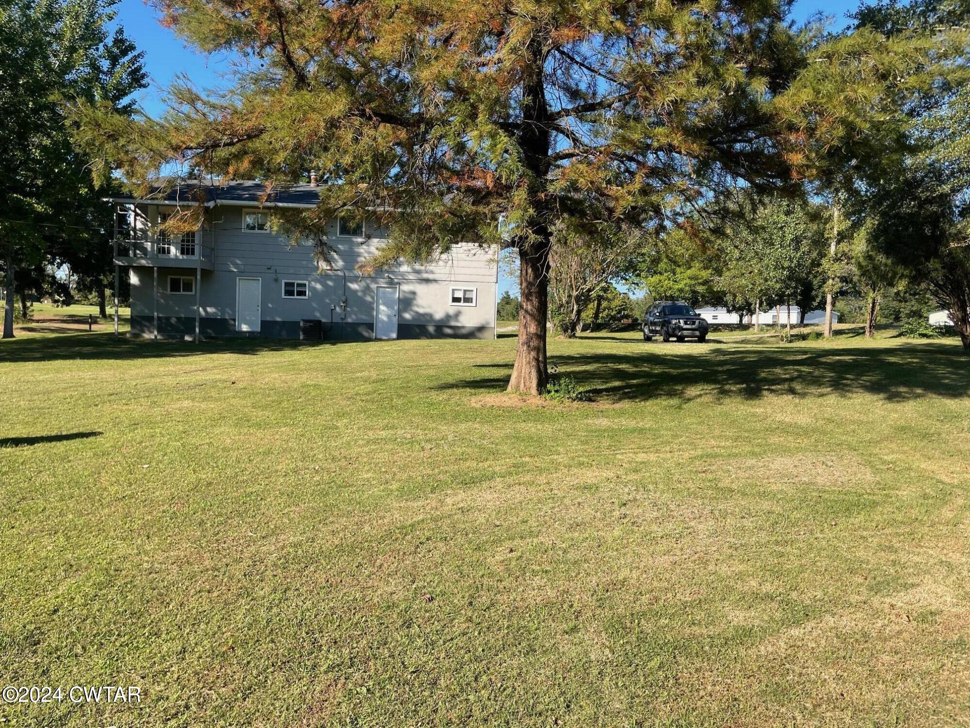 113 Ebenezer Road Mercer, TN 38392 - Photo 29 of 36 a view of a house with a yard