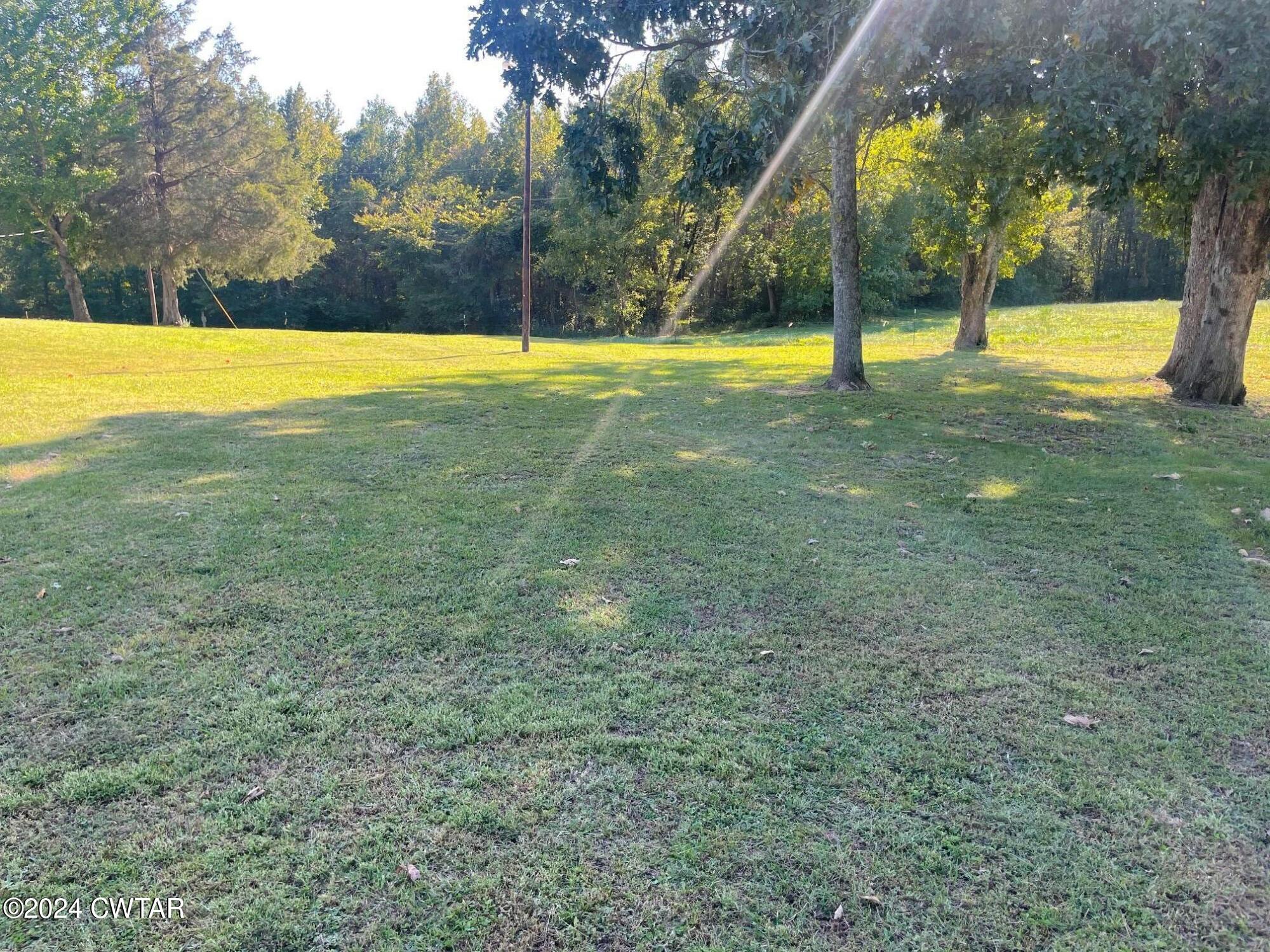 113 Ebenezer Road Mercer, TN 38392 - Photo 31 of 36 a view of a swimming pool with an outdoor space and seating area