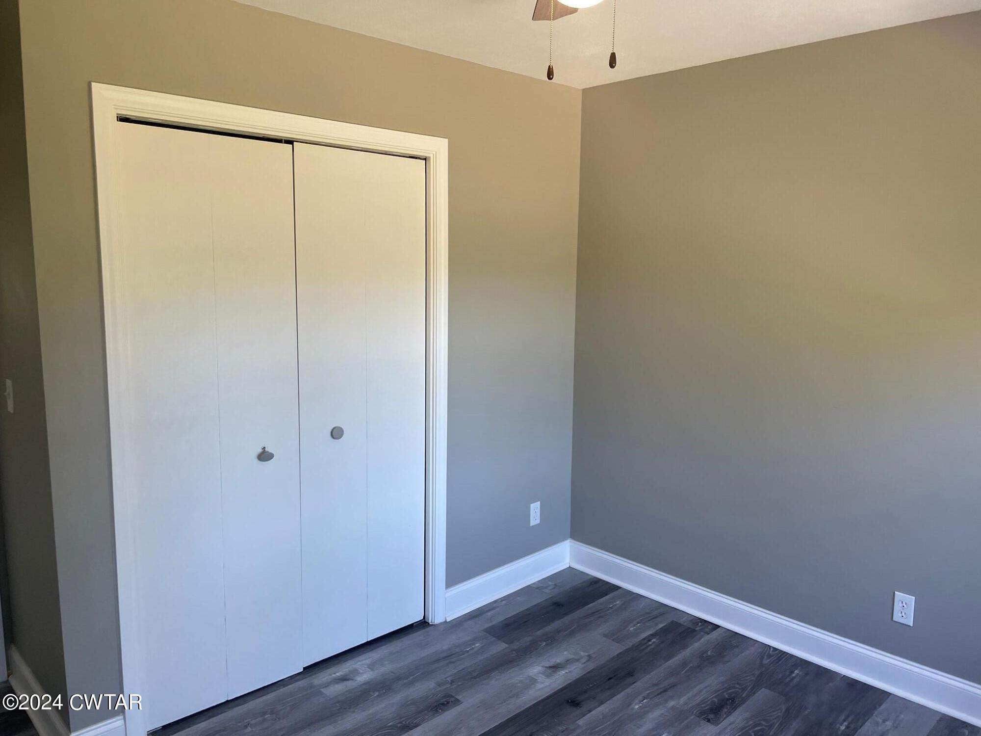 113 Ebenezer Road Mercer, TN 38392 - Photo 34 of 36 a view of an empty room with wooden floor