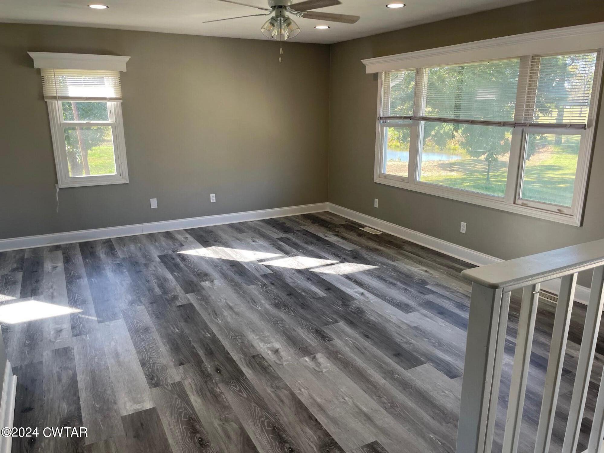 113 Ebenezer Road Mercer, TN 38392 - Photo 4 of 36 a view of empty room with wooden floor and fan