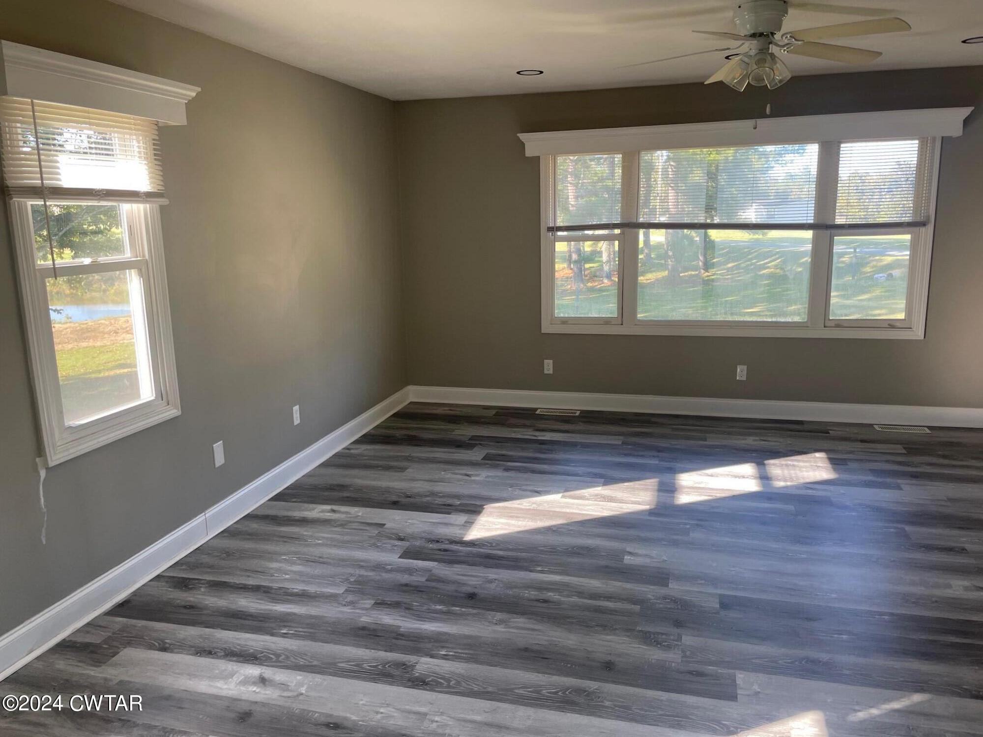 113 Ebenezer Road Mercer, TN 38392 - Photo 8 of 36 a view of empty room with wooden floor and fan